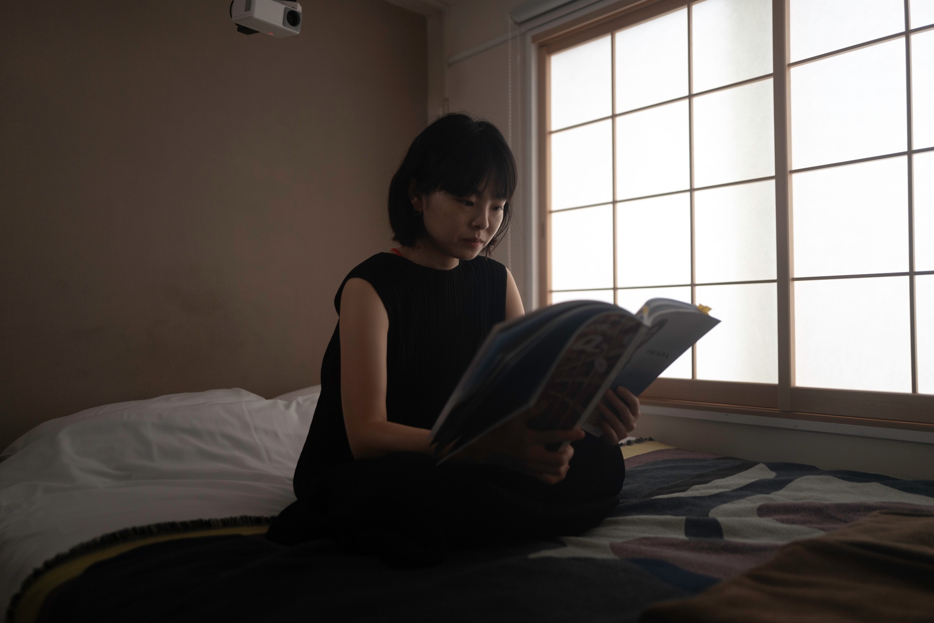 Guest reading by shoji window