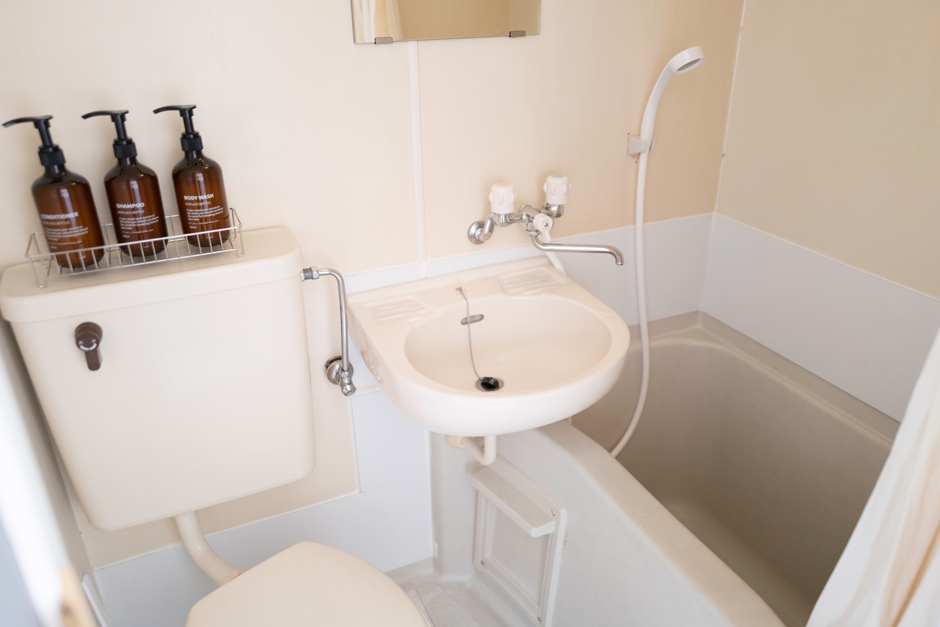Bathroom with shower and amenities